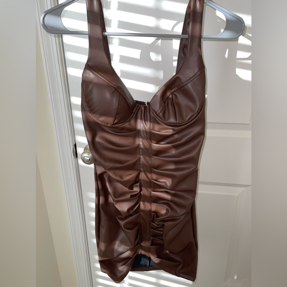 Brown mini bodycon dress. New and never worn,with tag. Perfect party club dress
